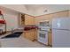 Kitchen with stainless steel appliances, tile floors, and laminate cabinets at 200 4Th S Ave # 220, St Petersburg, FL 33701