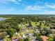 Aerial view shows a neighborhood with pools and solar panels in clear skies at 2013 Capri Rd, Valrico, FL 33594