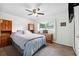 Comfortable bedroom features wood furnishings, a window, and carpeted floors at 2013 Capri Rd, Valrico, FL 33594
