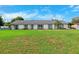 Charming single-story home with spacious front yard and manicured lawn at 2013 Capri Rd, Valrico, FL 33594