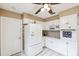 Bright kitchen features white cabinets, modern appliances, and neutral countertops at 2013 Capri Rd, Valrico, FL 33594