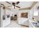 Open-concept kitchen and living room area with tiled floors and neutral décor at 2013 Capri Rd, Valrico, FL 33594