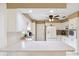 Functional kitchen with white cabinets and a breakfast bar, perfect for casual dining and meal preparation at 2013 Capri Rd, Valrico, FL 33594