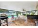 Spacious screened patio boasts a hot tub, outdoor seating, and access to the pool at 2013 Capri Rd, Valrico, FL 33594