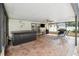 Covered patio featuring a hot tub, ceiling fan, TV, and barbecue grill at 2013 Capri Rd, Valrico, FL 33594