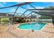 An inviting pool with brick pavers and a screened enclosure offers relaxation and fun in a private backyard at 2013 Capri Rd, Valrico, FL 33594