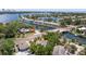 Waterfront community aerial view with the home nestled among mature trees and lush landscaping near the water at 202 39Th S Ave, St Petersburg, FL 33705