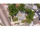 Aerial view showcases the home's location and surrounding foliage, providing a sense of privacy and tranquility at 202 39Th S Ave, St Petersburg, FL 33705