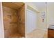Bathroom features tiled shower with bench and handrails at 202 39Th S Ave, St Petersburg, FL 33705
