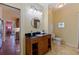 Bathroom features granite vanity, decorative mirror, tile floors, and a decorative stained glass window at 202 39Th S Ave, St Petersburg, FL 33705