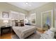 Bedroom showcasing ample natural light from large windows and warm, neutral decor at 202 39Th S Ave, St Petersburg, FL 33705
