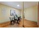 Cozy dining area featuring a glass-top table, modern black chairs, and hardwood floors at 202 39Th S Ave, St Petersburg, FL 33705