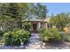 Inviting front exterior showcasing a stone walkway, lush landscaping, and charming architectural details at 202 39Th S Ave, St Petersburg, FL 33705