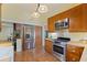 Spacious kitchen featuring stainless steel appliances, wood cabinets, tile floors and breakfast bar at 202 39Th S Ave, St Petersburg, FL 33705