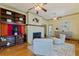 Open living room featuring a fireplace, shelving and views into other rooms of the home at 202 39Th S Ave, St Petersburg, FL 33705