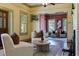 Cozy living room featuring hardwood floors, plush seating, and charming decorative accents at 202 39Th S Ave, St Petersburg, FL 33705