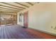 Covered porch with a painted wood floor, a view of the yard, and a screen awning at 202 39Th S Ave, St Petersburg, FL 33705