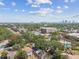 Scenic aerial shot showcasing the neighborhood with a view of the city skyline in the distance at 2230 Melrose S Ave, St Petersburg, FL 33712