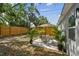 Fenced backyard features patio area with seating, landscaping, and a privacy fence at 2230 Melrose S Ave, St Petersburg, FL 33712