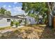 Spacious backyard with patio, mature landscaping, and privacy fence at 2230 Melrose S Ave, St Petersburg, FL 33712