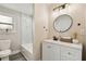 Updated bathroom with white vanity, a modern mirror, and a tiled shower/tub combination at 2230 Melrose S Ave, St Petersburg, FL 33712