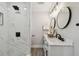 Beautiful bathroom featuring white marble tiled shower and vanity with dual sinks at 2230 Melrose S Ave, St Petersburg, FL 33712