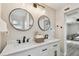 Bright bathroom features dual sinks with black hardware and modern lighting at 2230 Melrose S Ave, St Petersburg, FL 33712