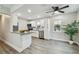 Updated kitchen with white cabinets, granite countertops, stainless steel appliances, and modern fixtures at 2230 Melrose S Ave, St Petersburg, FL 33712