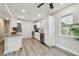 Updated kitchen with white cabinets, granite countertops, stainless steel appliances, and wood-look flooring at 2230 Melrose S Ave, St Petersburg, FL 33712