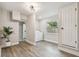 Bright laundry room features modern washer and dryer, wood-look floors, and neutral paint at 2230 Melrose S Ave, St Petersburg, FL 33712