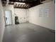 Basement features painted floor, large window, and newly painted walls at 2254 66Th S Ave, St Petersburg, FL 33712