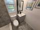 Bright bathroom featuring a toilet and updated vanity with sleek fixtures and stylish decor at 2254 66Th S Ave, St Petersburg, FL 33712