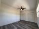 Spacious bedroom featuring wood-look flooring, a fan, and double closets at 2254 66Th S Ave, St Petersburg, FL 33712