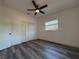 Bedroom featuring new laminate flooring, window, and closet at 2254 66Th S Ave, St Petersburg, FL 33712