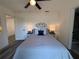 Comfortable bedroom with stylish decor featuring a ceiling fan and bedside lamps at 2254 66Th S Ave, St Petersburg, FL 33712