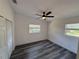 Bedroom featuring new laminate flooring, windows, and closet at 2254 66Th S Ave, St Petersburg, FL 33712