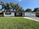 Charming single-story home with a manicured front yard and attached one car garage at 2254 66Th S Ave, St Petersburg, FL 33712