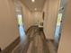 Inviting hallway with seating area and modern flooring with views of the exterior at 2254 66Th S Ave, St Petersburg, FL 33712