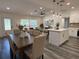 Open-concept living area featuring hardwood floors seamlessly connecting living, dining, and kitchen spaces at 2254 66Th S Ave, St Petersburg, FL 33712