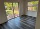 Living room with sliding glass doors and wood-look flooring at 2254 66Th S Ave, St Petersburg, FL 33712