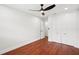 Light filled bedroom with a ceiling fan, hardwood floors, and a closet at 226 Willowick Ave, Temple Terrace, FL 33617