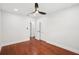 Bright bedroom featuring hardwood floors, a ceiling fan, recessed lighting, and an adjacent closet at 226 Willowick Ave, Temple Terrace, FL 33617