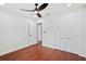 Neutral bedroom with hardwood floors features a ceiling fan and closet at 226 Willowick Ave, Temple Terrace, FL 33617