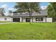 Charming two-story home with a well-kept lawn and a spacious driveway at 226 Willowick Ave, Temple Terrace, FL 33617