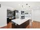 Modern kitchen with black cabinetry, a white quartz island, and stainless steel appliances at 226 Willowick Ave, Temple Terrace, FL 33617