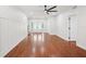 Bright and spacious living room with hardwood floors and decorative wall paneling at 226 Willowick Ave, Temple Terrace, FL 33617