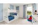 Fun bedroom with bunk beds, colorful accents, and a playful design at 2264 Rikkola Ln, Wesley Chapel, FL 33543