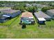 Aerial view of fenced in backyard with screened in pool and patio at 2829 Maple Brook Loop, Lutz, FL 33558