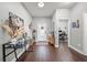 Welcoming entryway featuring hardwood floors, decor, and a glimpse into the office space at 2829 Maple Brook Loop, Lutz, FL 33558