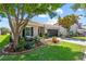 Charming single-story home with well-maintained landscaping, mature trees, and a two-car garage at 2829 Maple Brook Loop, Lutz, FL 33558